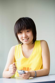 Portrait of a girl holding a mobile phone
