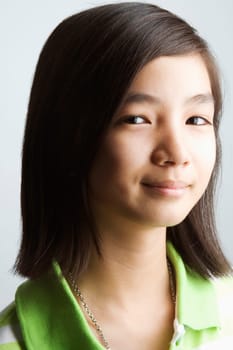 Portrait of a teenage girl smirking