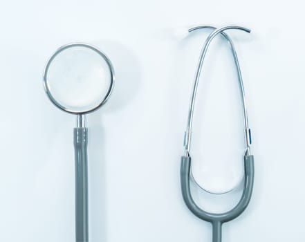 Stethoscope for doctor checkup on health medical laboratory table as medical concept