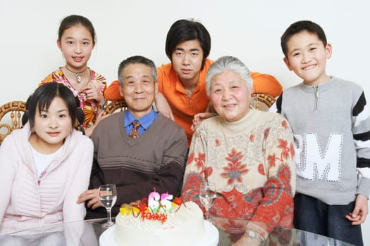 Portrait of a family at a birthday party