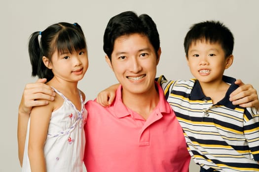 Portrait of a young man with his son and daughter