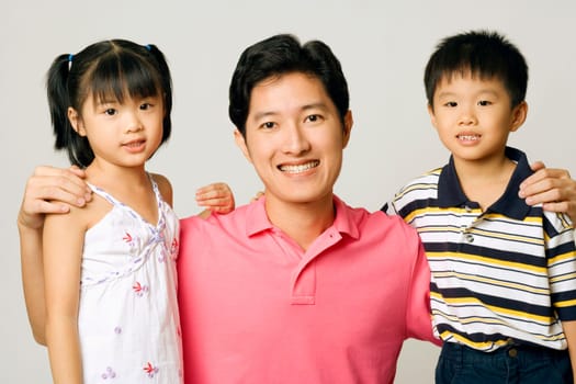 Portrait of a young man with his son and daughter