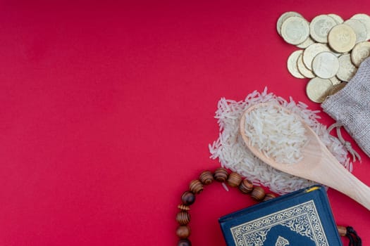 Holy Quran , Coins, Rosary and rice. Zakat concept. Zakat is a form of alm-giving as a religious obligation