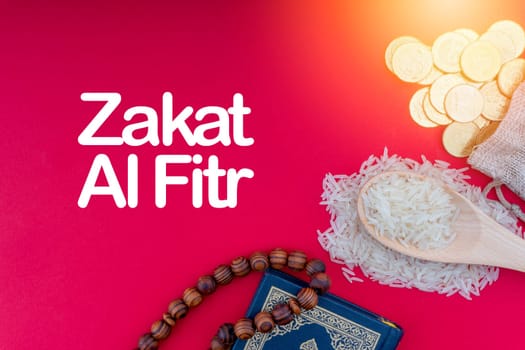 ZAKAT words with Holy Quran, Coins, Rosary and Rice. Zakat concept. Zakat is a form of alm-giving as a religious obligation