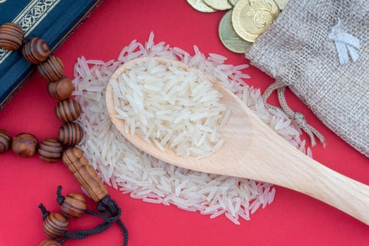 Holy Quran, Coins,Rosary and rice. Zakat concept. Zakat is a form of alm-giving as a religious obligation