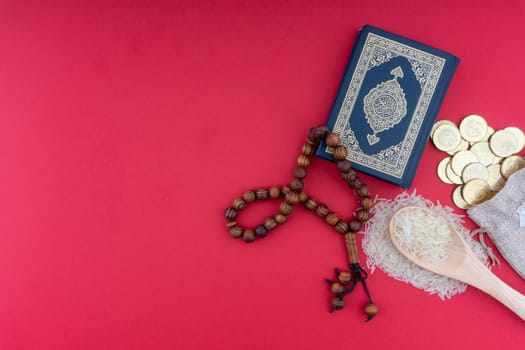 Holy Quran, Coins,Rosary and rice. Zakat concept. Zakat is a form of alm-giving as a religious obligation
