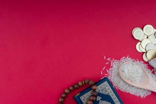 Holy Quran, Coins,Rosary and rice. Zakat concept. Zakat is a form of alm-giving as a religious obligation