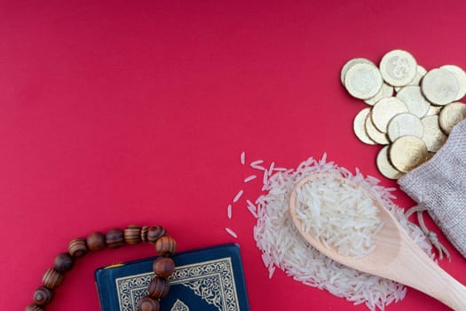 Holy Quran, Coins,Rosary and rice. Zakat concept. Zakat is a form of alm-giving as a religious obligation