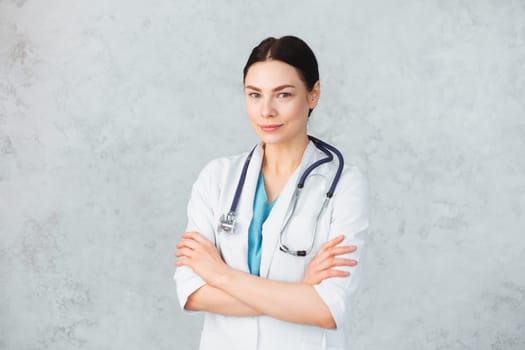 Young female doctor with stethoscope and folder. caucasian brunette.