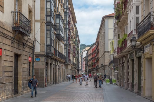 Walkers in the historic old town of Bilbao, Spain
