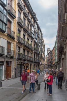 Walkers in the historic old town of Bilbao, Spain