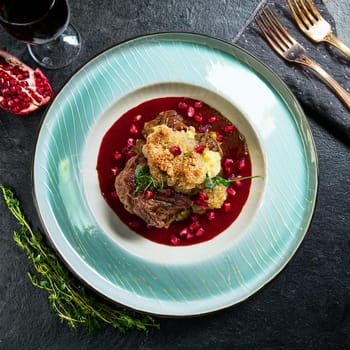 Ris de veau laque features tender sweetbreads beautifully glazed with pomegranate molasses and accompanied by delicate salsify and mustard seeds.