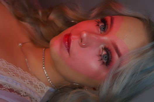 young woman with makeup, vintage style, heart makeup with curly hair, pink soft colours