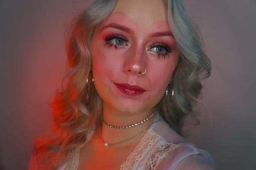 young woman with makeup, vintage style, heart makeup with curly hair, pink soft colours