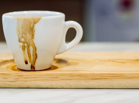 Dirty cup after drinking coffee . Empty used cup  . Hurry busy time . modern lifestyle in city .