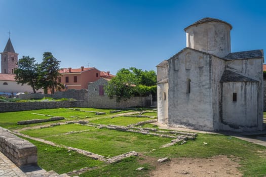 Old, dated on 9th century, Church of the Holy Cross in early Romanesque architecture, located in old district of Nin town on small island, Croatia