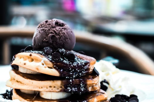 Stack of Homemade Chocolate Pancakes with Chocolate Ice-Cream Scoops dessert delicious after meat