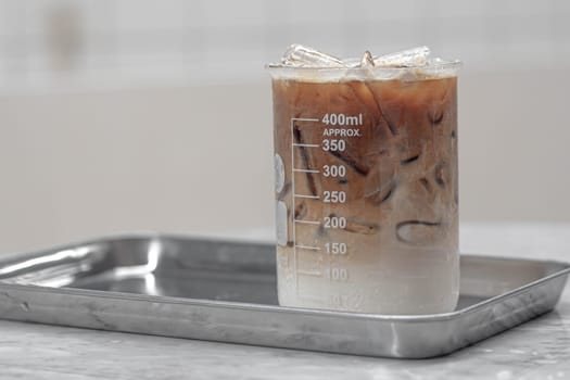 Beverage drinks come in a beaker. Cocktail served in a laboratory beaker at a science-themed bar. Chemistry bar Beaker Cocktail Glass Set