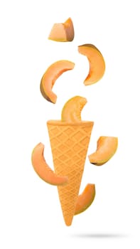 Isolated flying fruit. Seven slices of yellow melon fruits falling down in ice cream cone with clipping path. Accurate retouching fruits for package design element. Full depth of field.