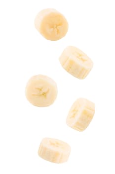 Isolated exotic fruit. Five slices of banana fruits falling down with clipping path. Accurate retouching fruits for package design element. Full depth of field. Food levitation concept.