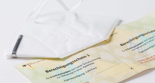 Hockenheim, Germany - February 02, 2021: Closeup of german government entitling certificate (berechtigungsschein) for ffp2 protection masks purchase warrant