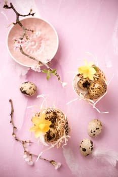 Easter eggs on with cherry branch in pink tone. Easter decoration in vintage style