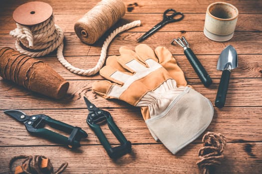 Gardening tools and equipment on wooden background