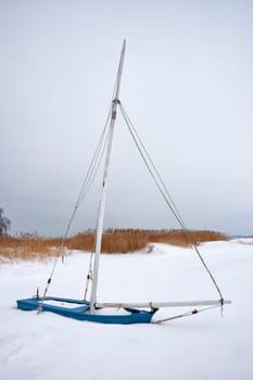 Frozen and snowed-in sailing boat on the Saaler Bodden, Fischland-Darß