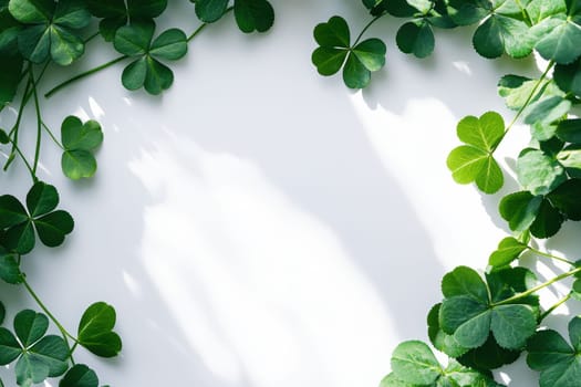 Saint Patrick's day background with sprayed green clover leaves or shamrocks..