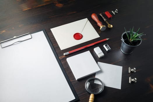 Blank branding identity set on wooden background. Corporate stationery template. For design presentations and portfolios.