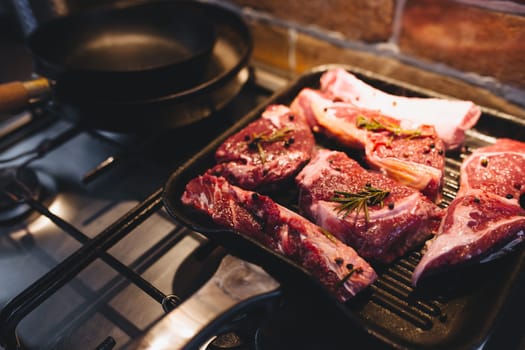Preparing steak on the grill pan with seasonings. High quality photo