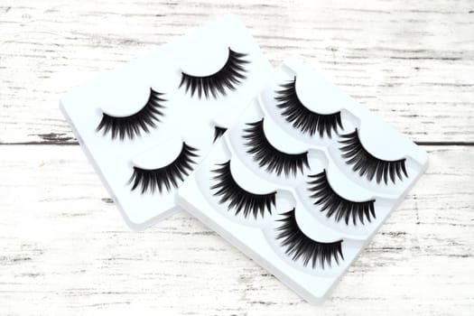 group of false eyelashes on white table
