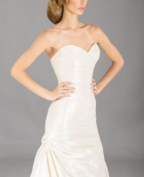 Beautiful bride on grey background. Studio shot