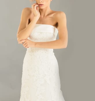 Beautiful bride on grey background. Studio shot