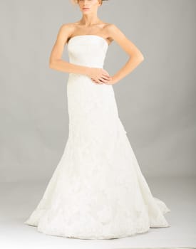 Beautiful bride on grey background. Studio shot