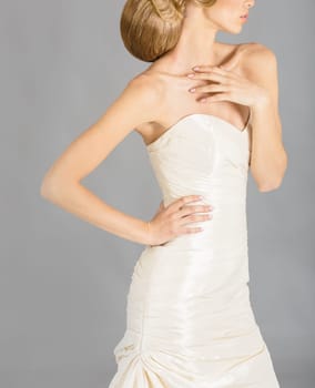 Beautiful bride on grey background. Studio shot