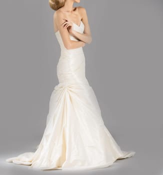 Beautiful bride on grey background. Studio shot