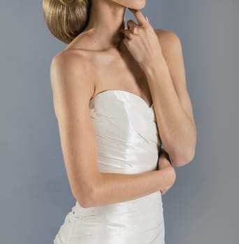 Beautiful bride on grey background. Studio shot