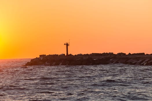 Harbor port beacon safety light structure  end of concrete pier for ships safety .
