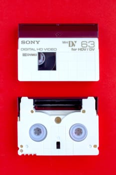 Calgary, Alberta, Canada. Feb 13, 2021. A SONY Digital HD Video, mini DV for HDV/DV Cassette on a red background