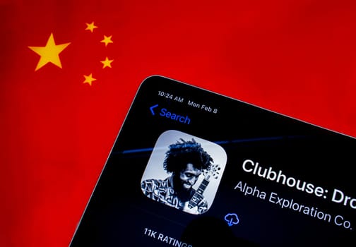Calgary, Alberta. Canada. Feb 8, 2021. An iPad with the Clubhouse application and the chinese flag on the background.