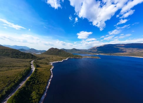 Aerial landscape of Lake Plimsoll on a hot summer's afternoon in Tasmania, Australia