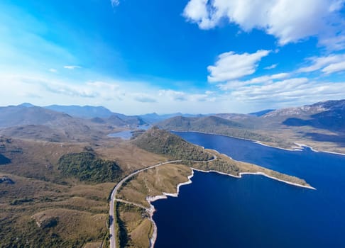 Aerial landscape of Lake Plimsoll on a hot summer's afternoon in Tasmania, Australia