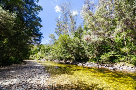 Frenchmans Cap Suspended Bridge in Franklin-Gordon Wild Rivers National Park on a hot summer's day in Tasmania, Australia