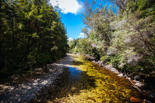 Frenchmans Cap Suspended Bridge in Franklin-Gordon Wild Rivers National Park on a hot summer's day in Tasmania, Australia