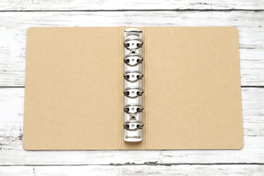 opened blank cover cardboard notebook with metal ring
