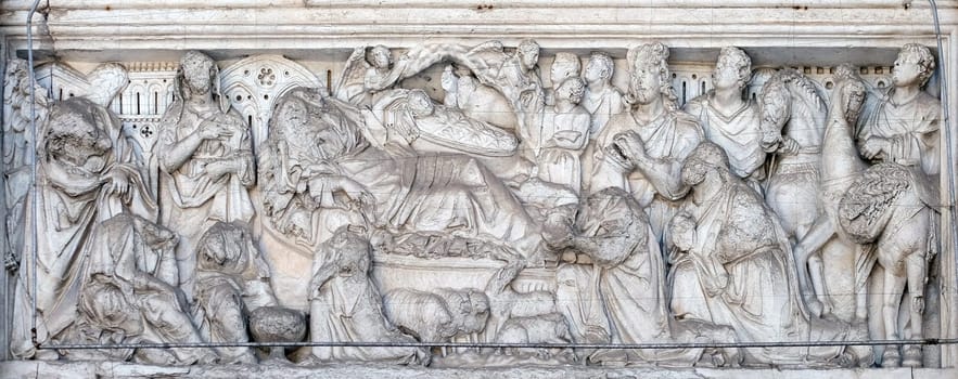Annunciation, Nativity and Adoration of the Magi, lunette over the portal of Cathedral of St Martin in Lucca, Italy