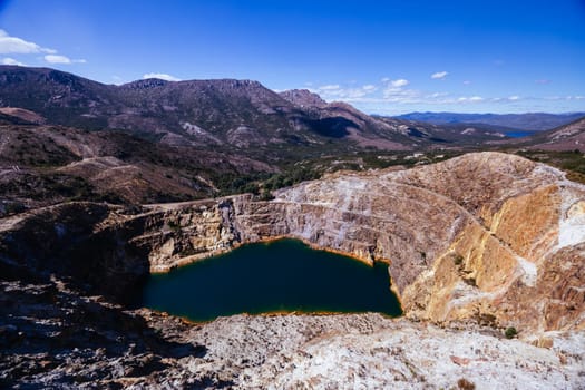 The view of Iron Blow Lookout on a hot summer's afternoon in Queenstown, Tasmania, Australia