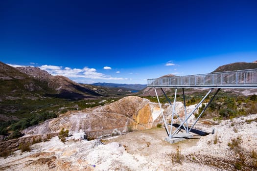 The view of Iron Blow Lookout on a hot summer's afternoon in Queenstown, Tasmania, Australia