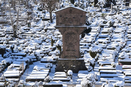 The Johannisfriedhof is located in the St. Johannis district of Nuremberg. Adam Kraft's station of the cross was built in 1506-1508. The cemetery is covered with snow in winter.